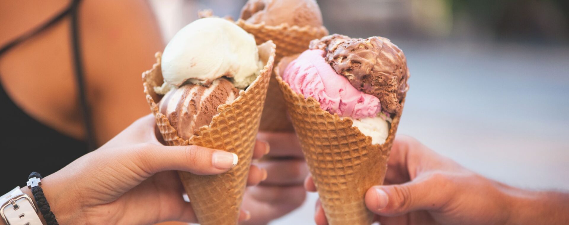 Three people with ice cream in their hands